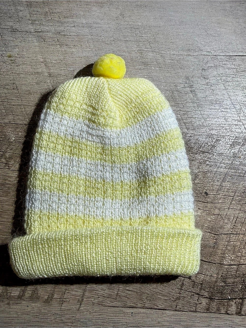 handmade yellow and white baby knit beanie with pom pom